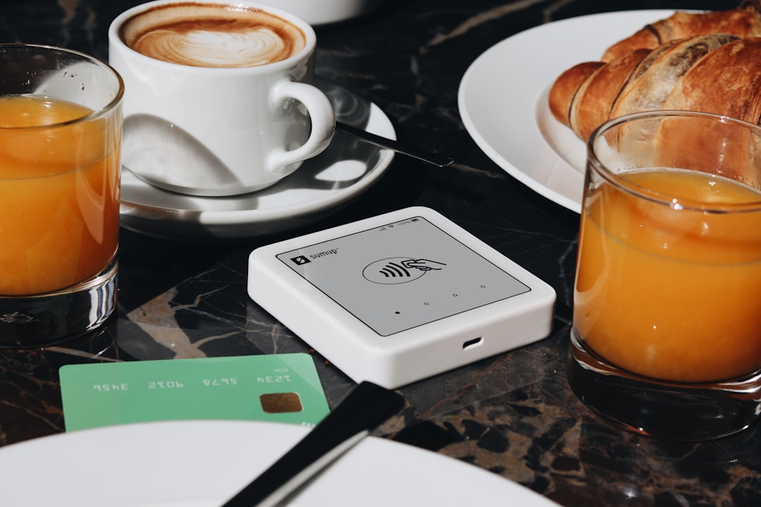 The Art of Drawing Readers In: Your attractive post title goes here A SumUp card reader is placed on a table, ready to accept contactless payments. The setup is ideal for small businesses and cafés, offering a sleek and efficient way for entrepreneurs to accept payments.